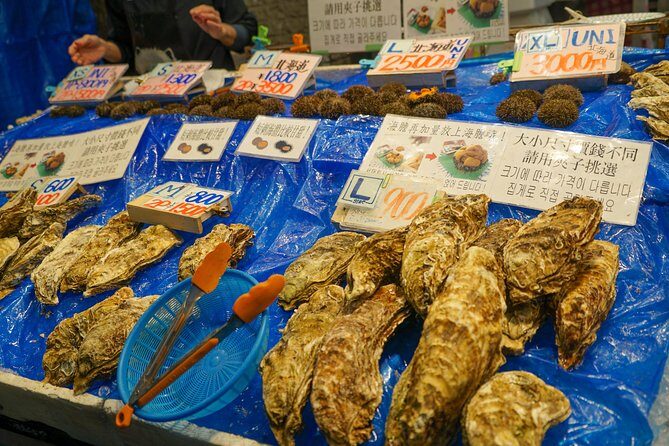 Kuromon Market Food Walking Tour in Osaka (6 stops, 6 tastes) - Nanba Grand Kagetsu and the comedy-theater vibe