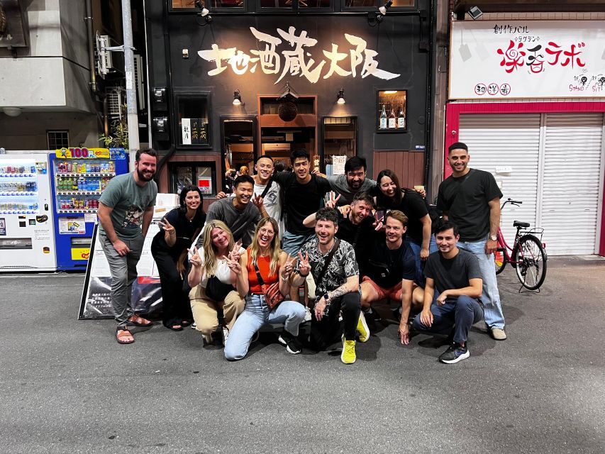 Osaka: Izakaya Bars Guided Walking Tour - Dotombori Humanity Song Monument: Your Meeting Point and First Sense of Place