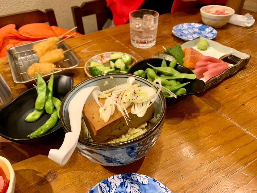 Osaka: Namba Pub Bar Crawl with a Local Guide - Stop 1 in Namba: Beer, Spirits, and an Izakaya-Style Starter
