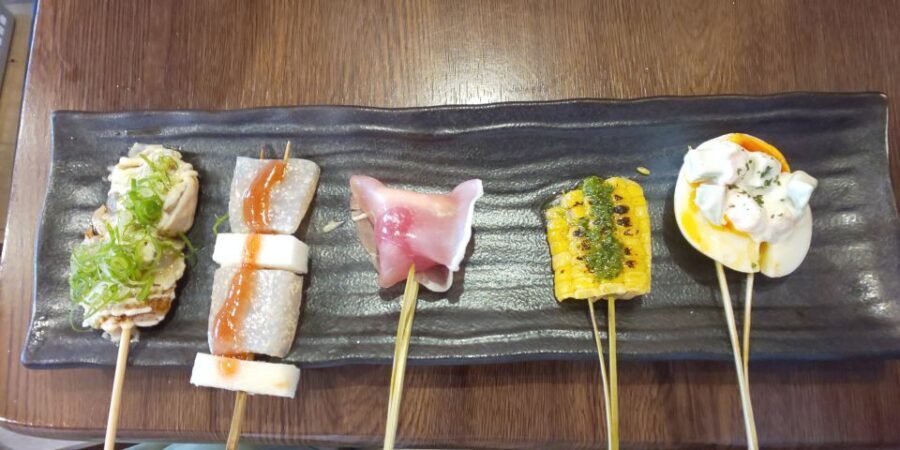 Osaka: Shinsekai Food Tour with 13-15 Dishes at 5 Eateries - Stop 5 Finale: Gyoza, Tonpeiyaki, Karaage, and the Last Sweet Note