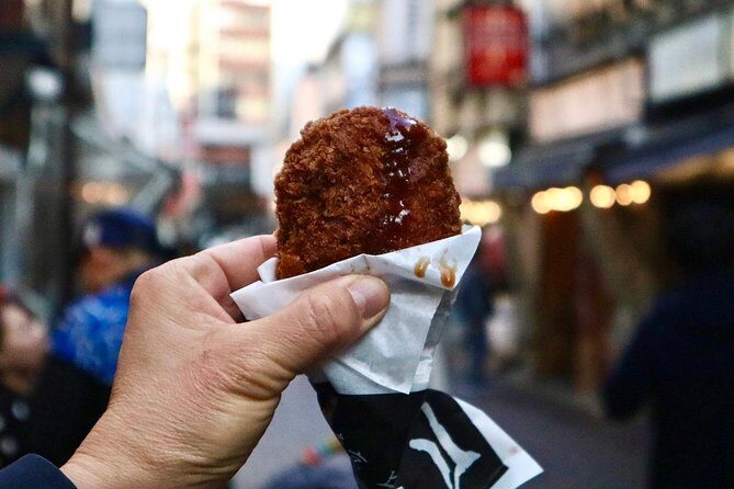 Tokyo: Food Tour in Ueno with 10+ Tastings of Japanese Classics - Buddhist grounds: quieter landscaping before dessert