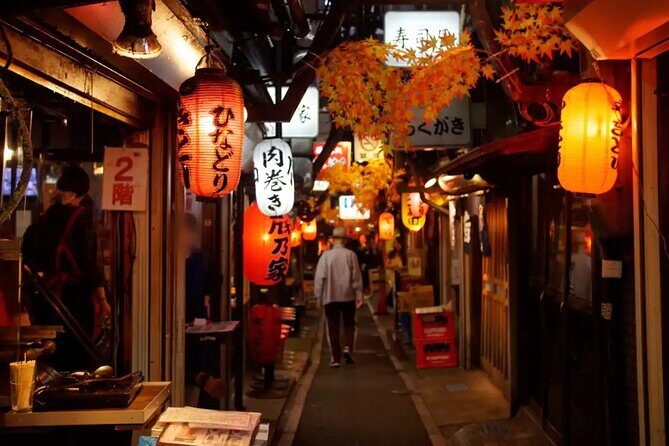 Tokyo: Shinjuku Food Tour (15 Dishes and 4 Eateries) - Finding the meeting spot by α 107 Building and the blue AOKI sign